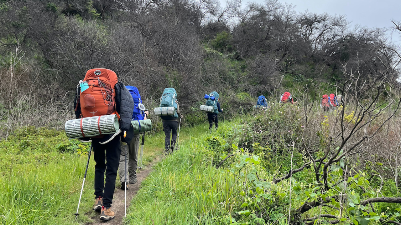 PORE_20220329_ATa_032_2X1.jpg Group of youth backpacking along a trail.