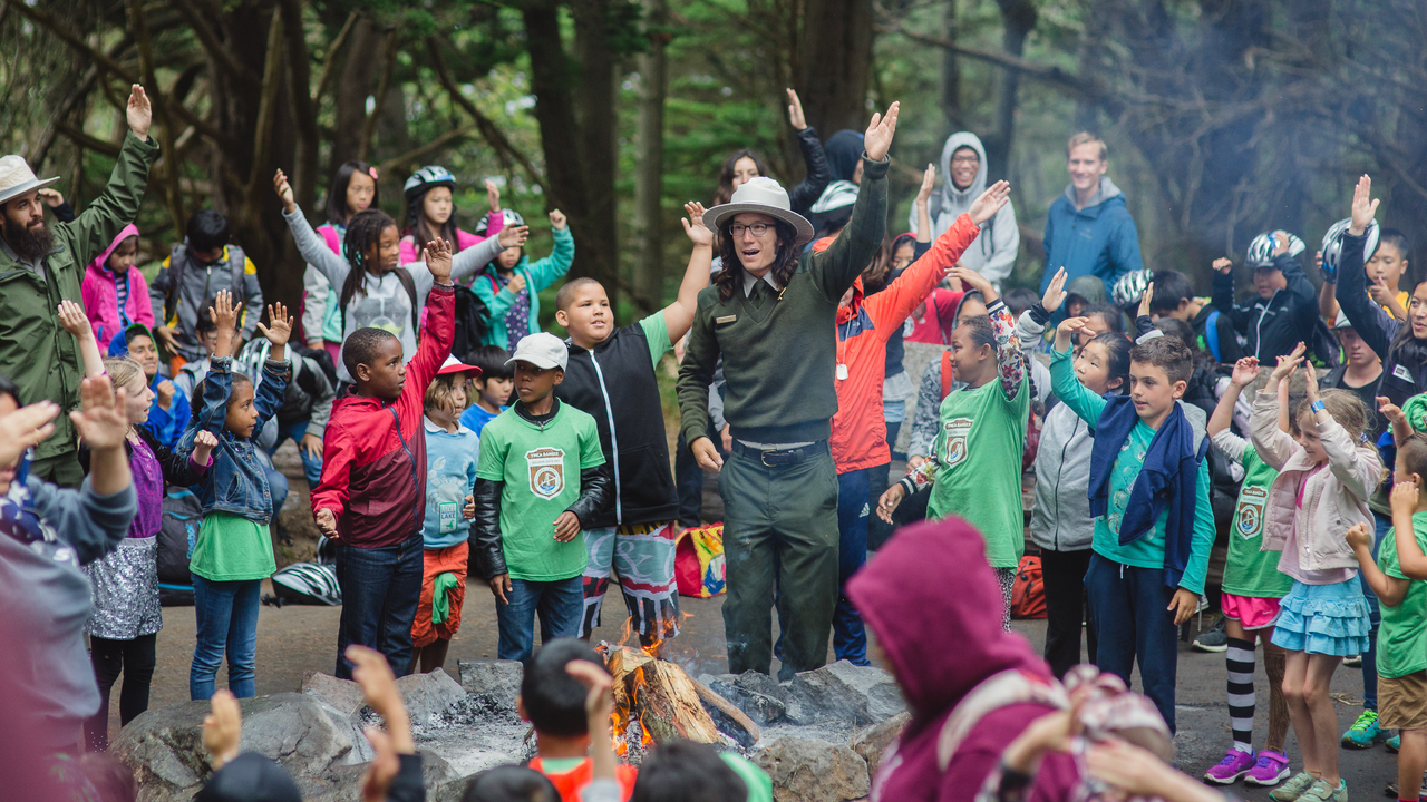 Story time at Rob Hill Campground A National Park Service Ranger leads a large group of smiling children in an interactive story