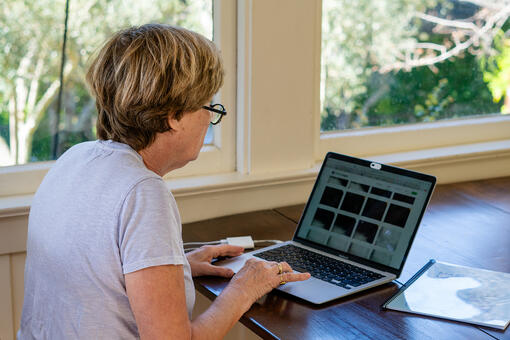 A volunteer uses a computer to track Marin Wildlife Watch images.
