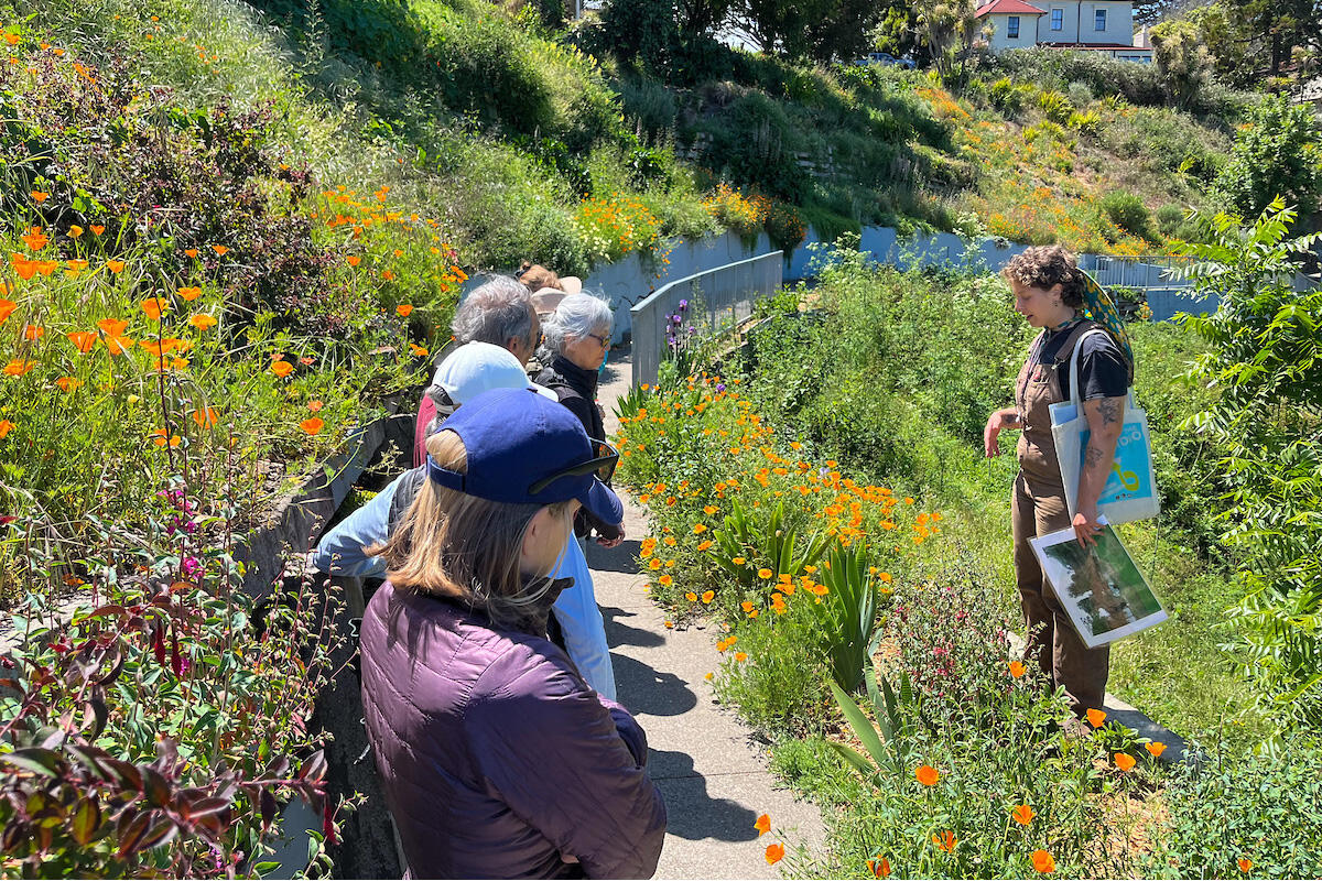 Natalie Korengold leading Parks Conservancy members through a tour of the gardens