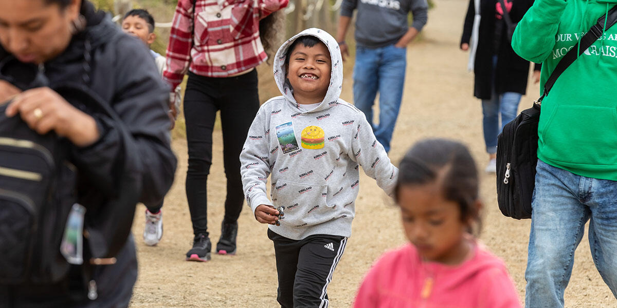 Participants from ALAS (Ayundando Latinos A Soñar) enjoying the "Raíces en la Bahía/Rooted in the Bay" event for farmworkers and their families in September 2024. Activities included crabbing, hiking, and beachside recreation.