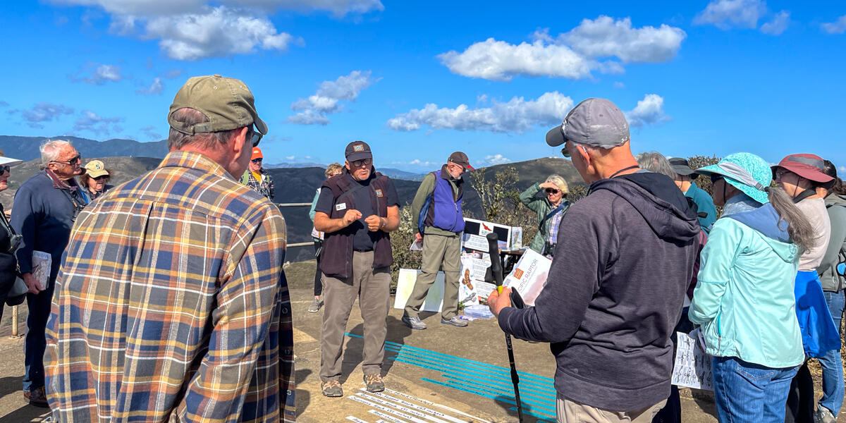 Golden Gate Raptor Observatory director Allen Fish informs Parks Conservancy members at Hawk Hill.