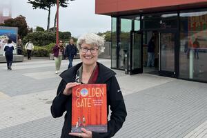 Photo of author Elizabeth Partridge in front of the Golden Gate Bridge Welcome Center.