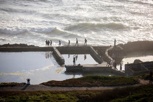 Visitors recreating in the Sutro Baths ruins