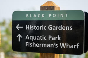 Sign that shows directions for Black Point Historic Gardens and Aquatic Park