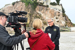 John Cantwell talks to reporters on Alcatraz Island.