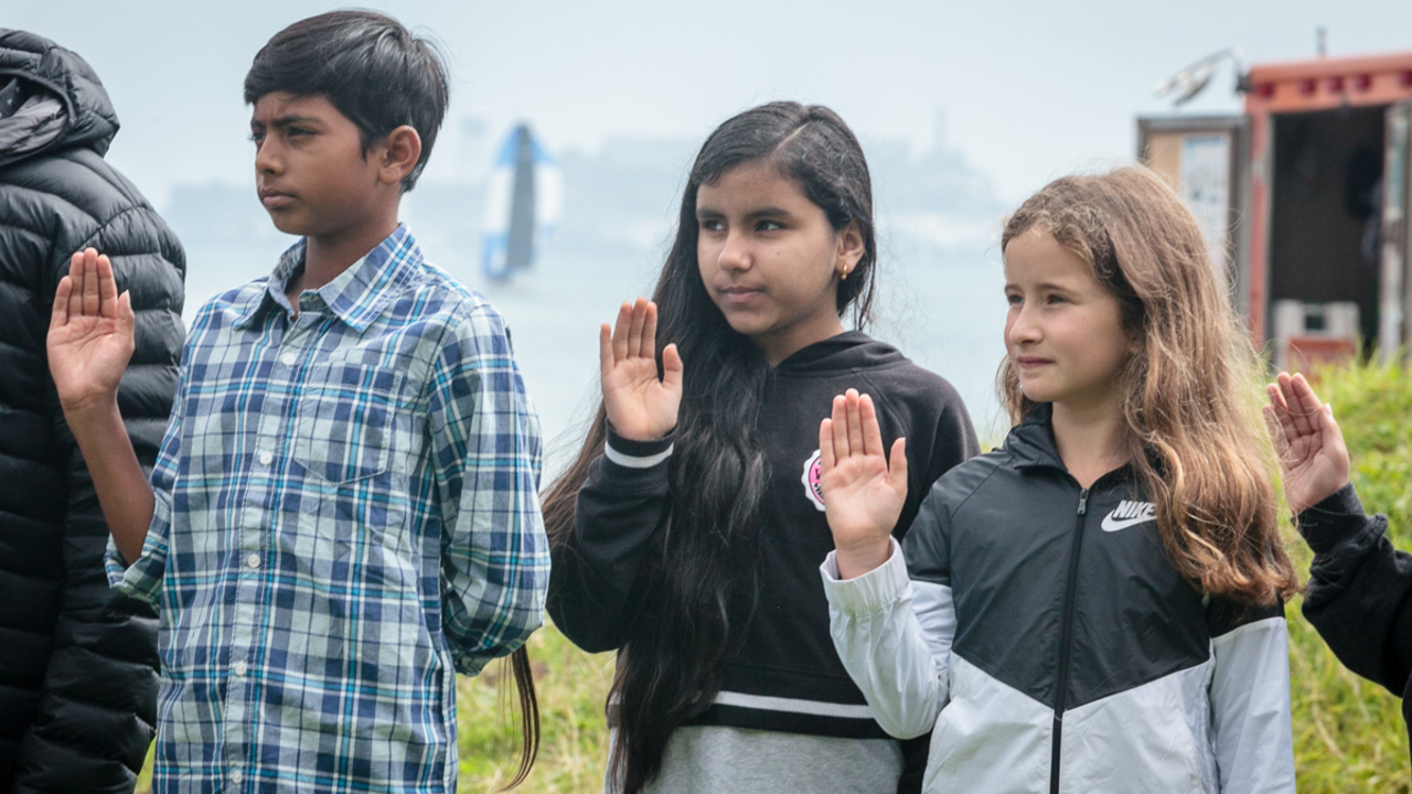 Young people participate in a special naturalization ceremony at Crissy Field. Crissy Field Naturalization Ceremony