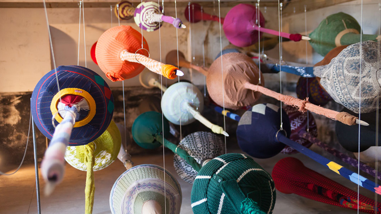 Homeland Security Exhibit installation by Yin Xiuzhen A barrage of weapons suspended in flight reveals itself on closer inspection to be an assortment of obscure objects made from secondhand clothes, worn fabric, and crocheted scraps