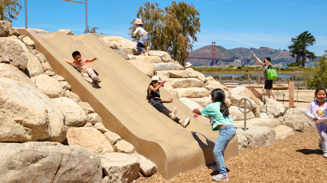 Children playing on Bluff Slide at Outpost Children playing on Bluff Slide at Outpost