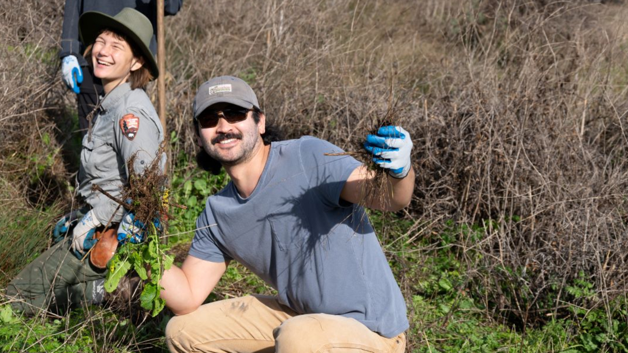 A volunteer strikes a pose while helping to restore Tennessee Valley. A volunteer strikes a pose while helping to restore Tennessee Valley.