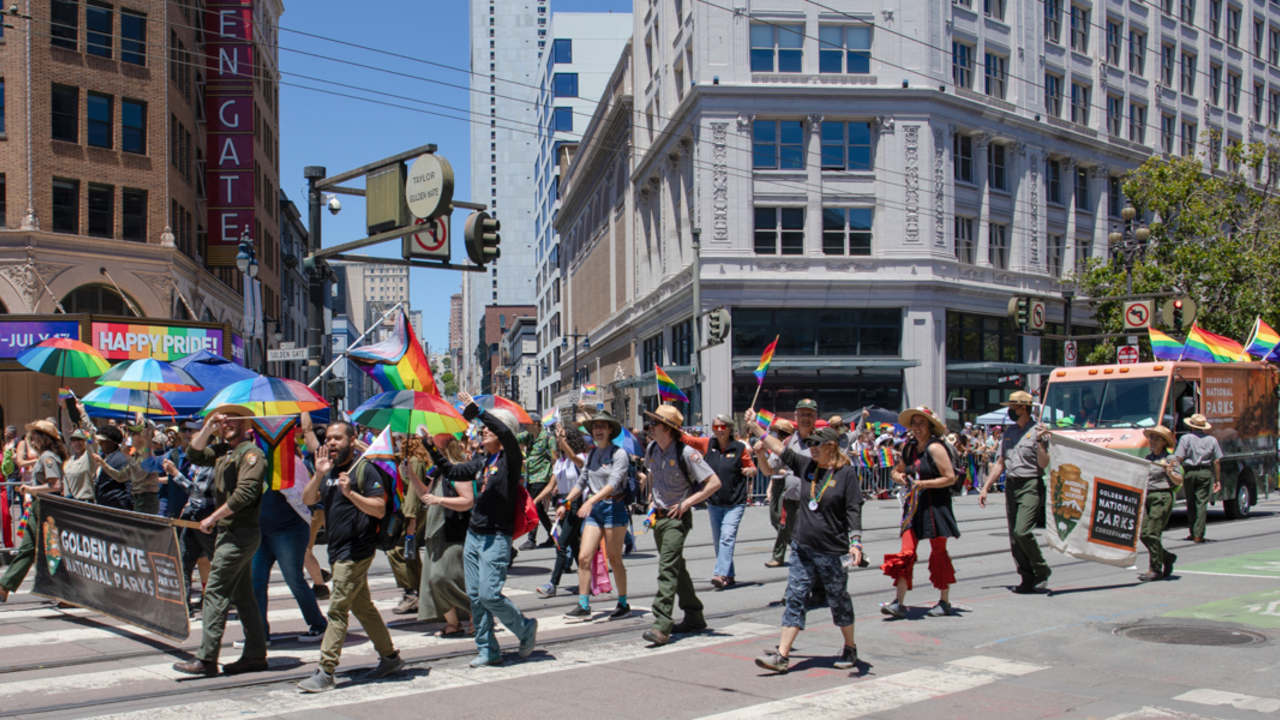 Marching along Market st. with partners from the GGNPS and Presidio Trust. The Golden Gate National Parks cohort marches down Market st. at the 2022 SF Pride parade.