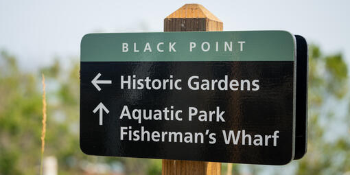 Sign that shows directions for Black Point Historic Gardens and Aquatic Park