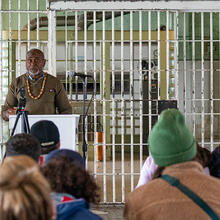 A formerly incarcerated speaker lectures in the Alcatraz Dining Hall