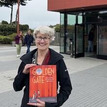 Photo of author Elizabeth Partridge in front of the Golden Gate Bridge Welcome Center.