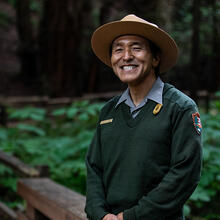 National Park Service ranger smiles in Muir Woods