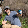 A volunteer strikes a pose while helping to restore Tennessee Valley.